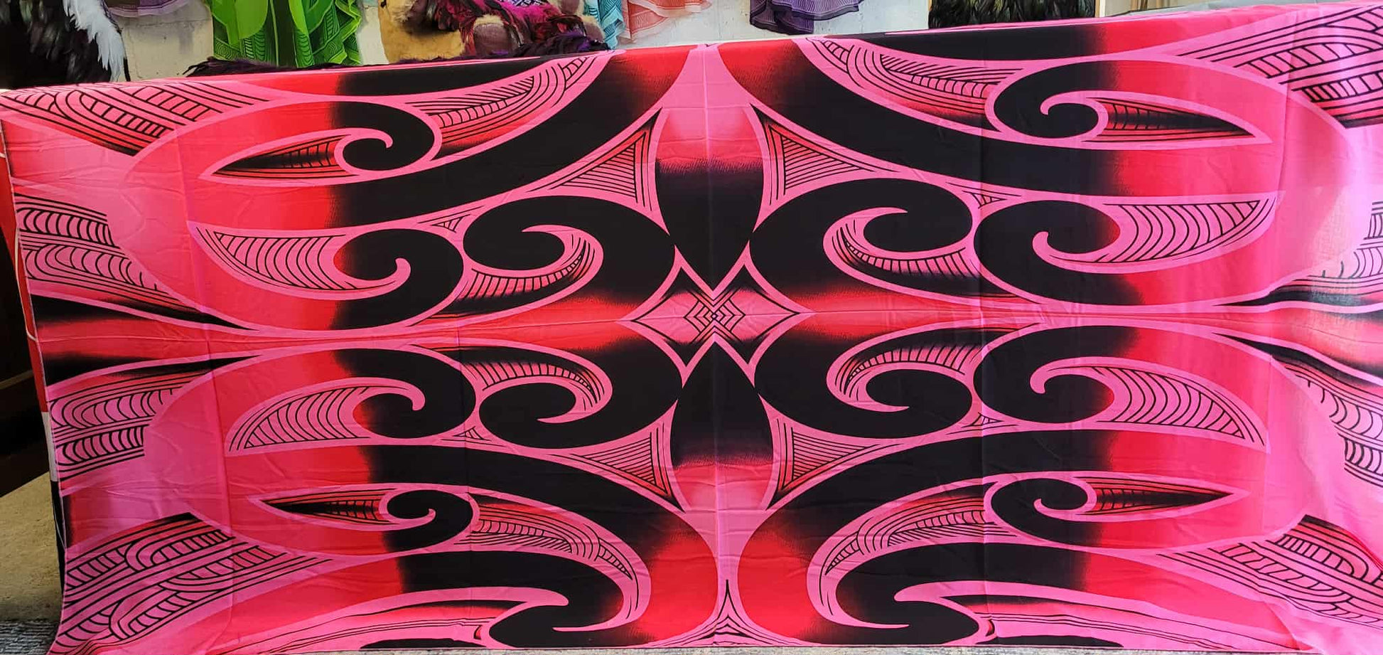 Pink and black patterned fabric with intricate designs